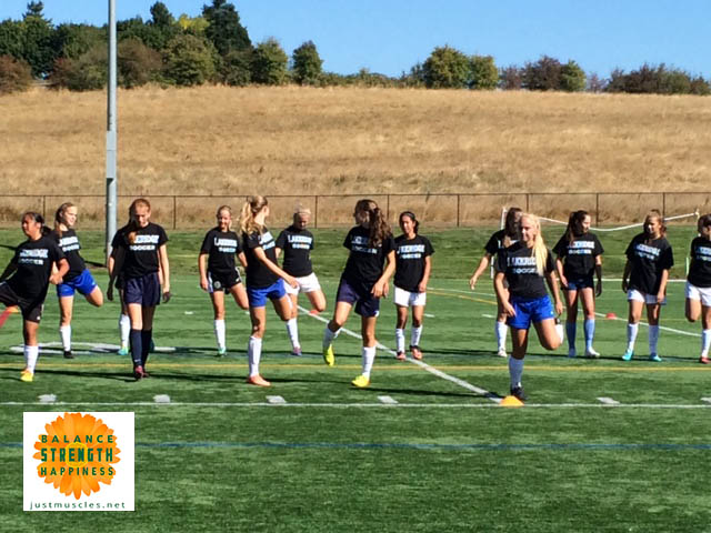 Image of a girls Soccer team warming up