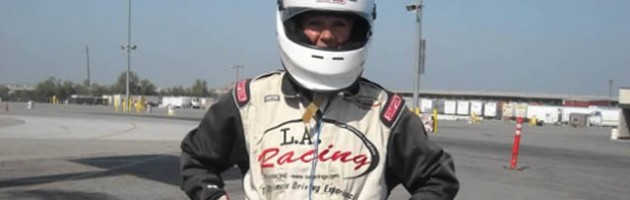 Image of Laura Coleman in race car fire suite