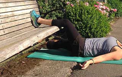 Image of personal trainer Laura Coleman in supine groin stretch position