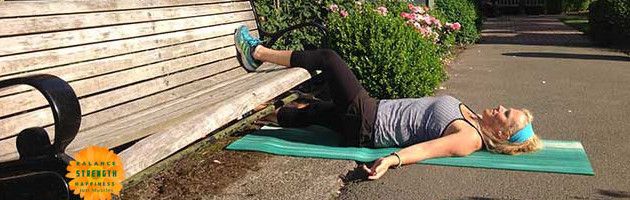 Image of personal trainer Laura Coleman in supine groin stretch position