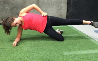 Image of woman doing a sideway plank exercise with Laura Coleman