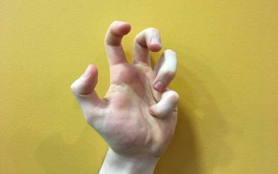 Image of hands in a pinkie fist hands yoga strengthening position
